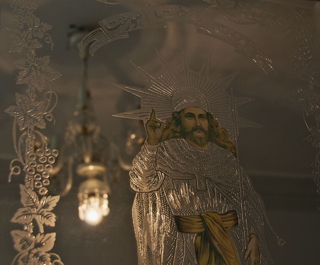 An image of Zoroaster appears on mirrored etched glass at the Zoroastrian Fire Temple in Taft, Iran (source - flickr)