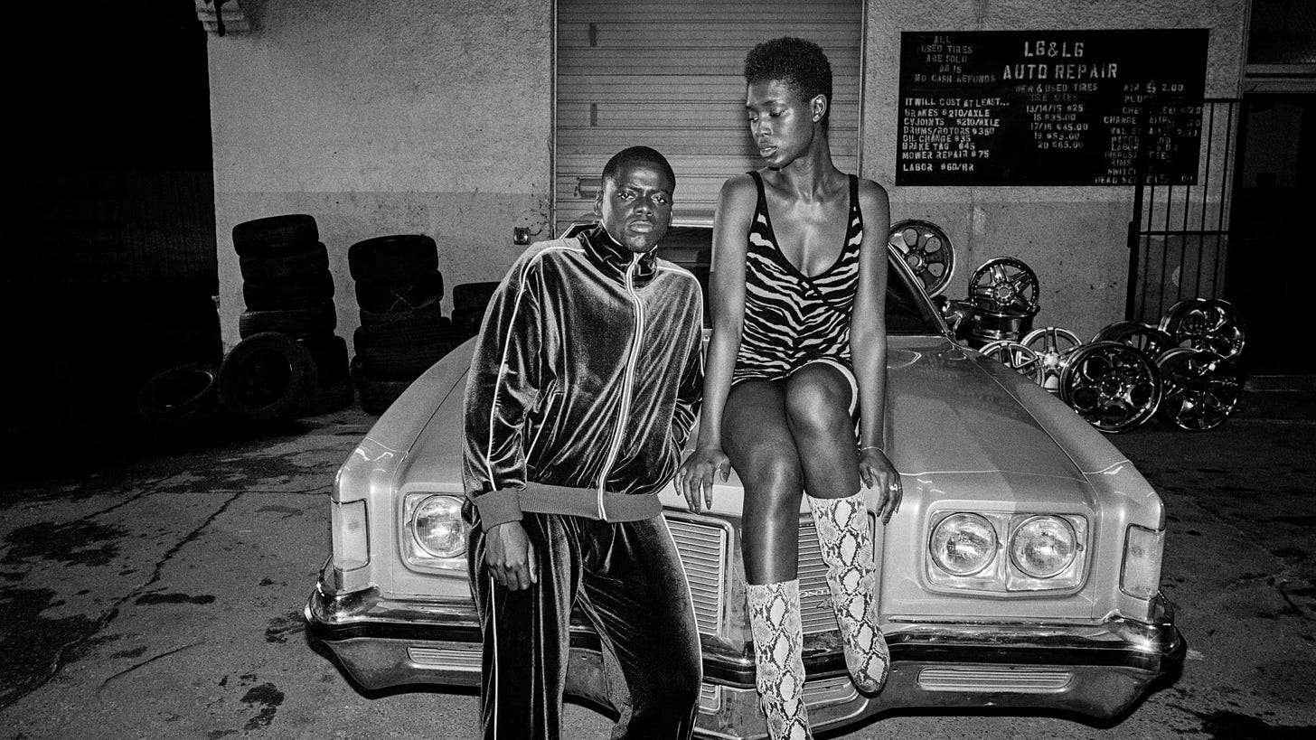 Daniel Kaluuya as Slim and Jodie Turner-Smith as Queen posing on a retro car
