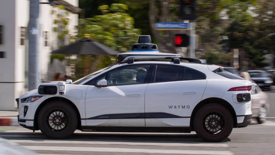 Passengers ride in an electric Waymo full self-driving technology in Santa Monica
