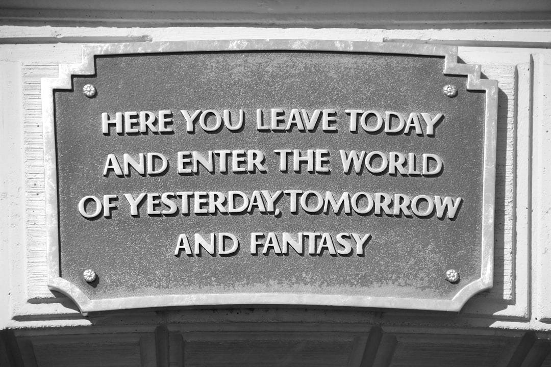 A sign on a building that says here you leave today and enter the world of A sign on a building that says here you leave today and enter the world of