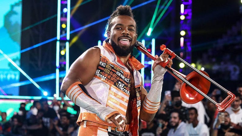 Xavier Woods walking to the ring with his trombone