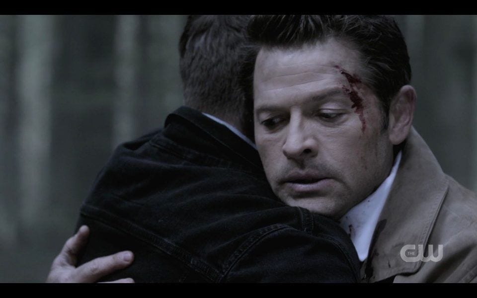 Bloody Castiel reacts to Dean Winchester hugging him in woods SPN