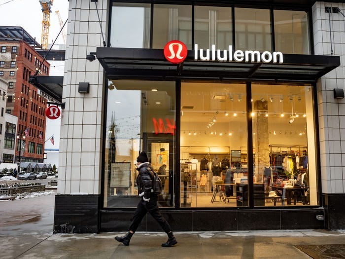 A person walks in front of a Lululemon store in Detroit.