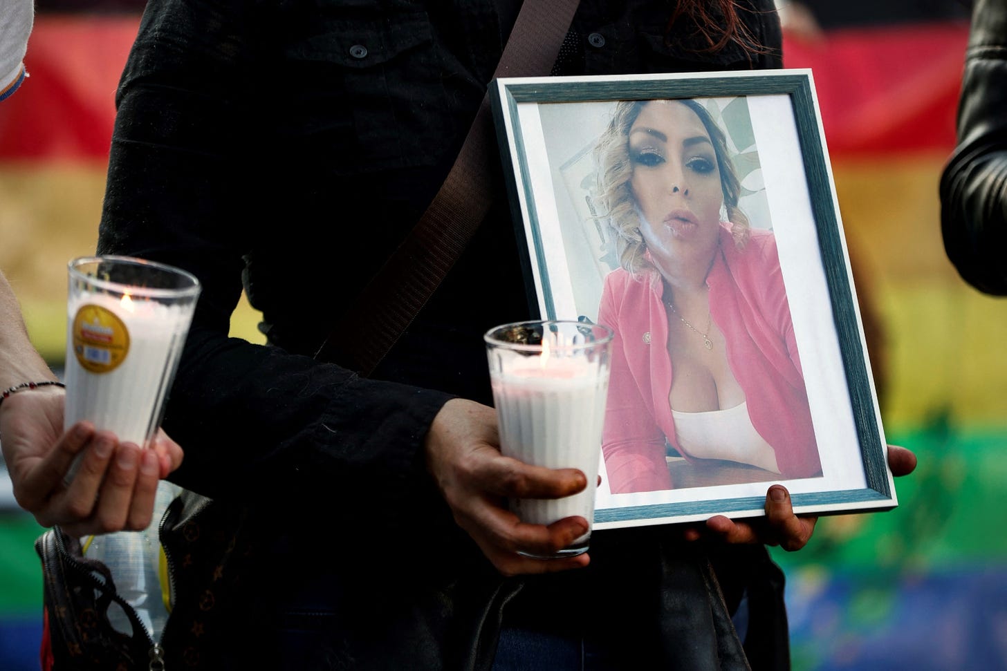 PHOTO: A demonstrator holds a candle and a picture of trans woman activist Samantha Gomes as members of the LGBTQ community take part in a protest following Gomes' murder, Jan. 15, 2024, in Mexico City.