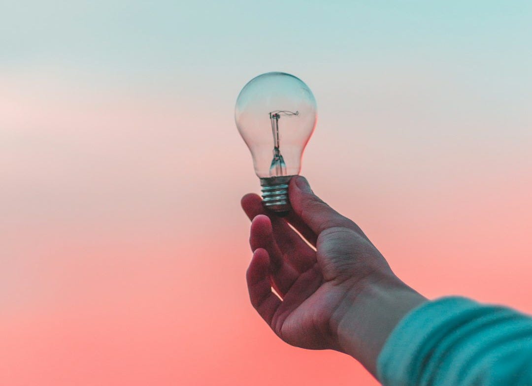 person holding light bulb