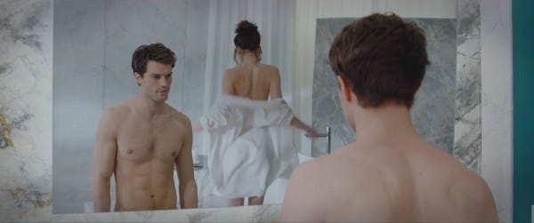 jamie dornan shirtess with dakota johnson in fifty shades of grey movie 2015