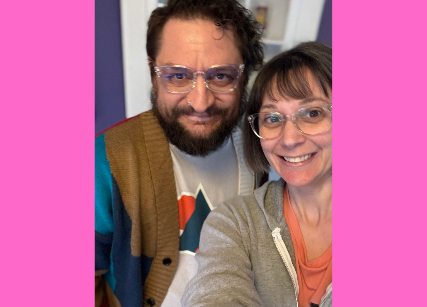 Photo of a man and woman wearing matching glasses