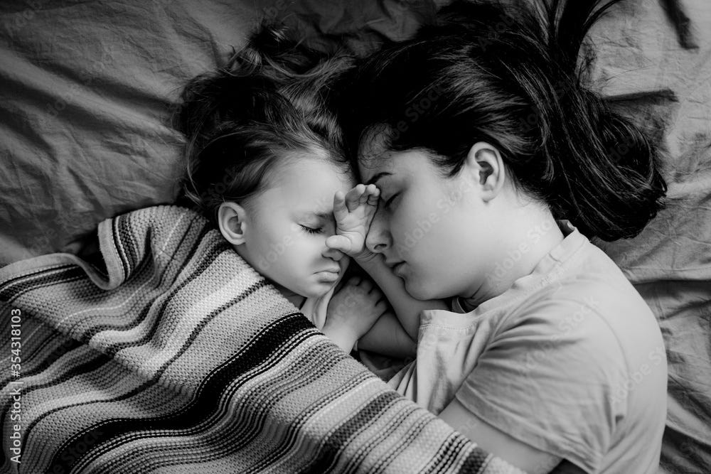 Young mother and baby of 2 years sleep together hugging, daytime sleep  concept for children. Mom fell asleep with her baby while putting her to  sleep. Black and white Stock Photo |