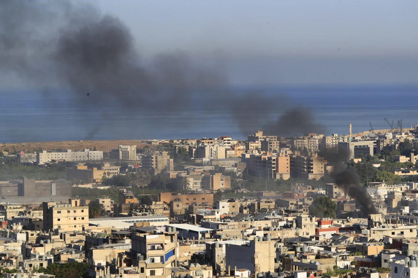 An AP image from September 9, 2023, of smoke rising over the Ein el-Hilweh camp in Sidon