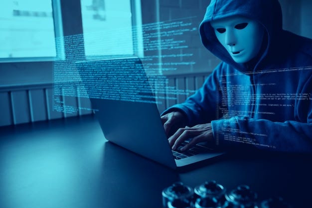 Asian people hacker wear a mask using a laptop cyber attack.