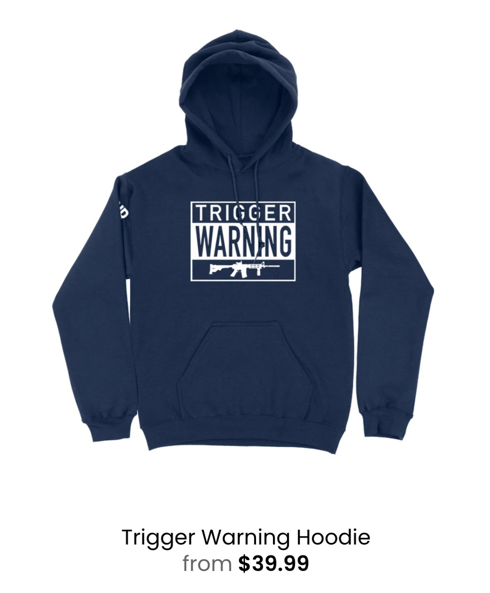 Navy hoodie with picture of gun and text reading 'Trigger Warning'