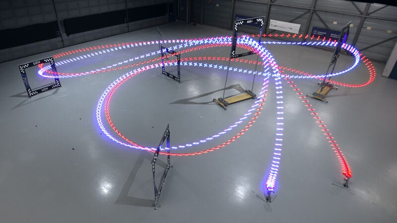 A long-exposure image of an AI-trained autonomous UZH drone (the blue streak) that completed a lap half a second ahead of the best time of a human pilot. A long-exposure image of an AI-trained autonomous UZH drone (the blue streak) that completed a lap half a second ahead of the best time of a human pilot.