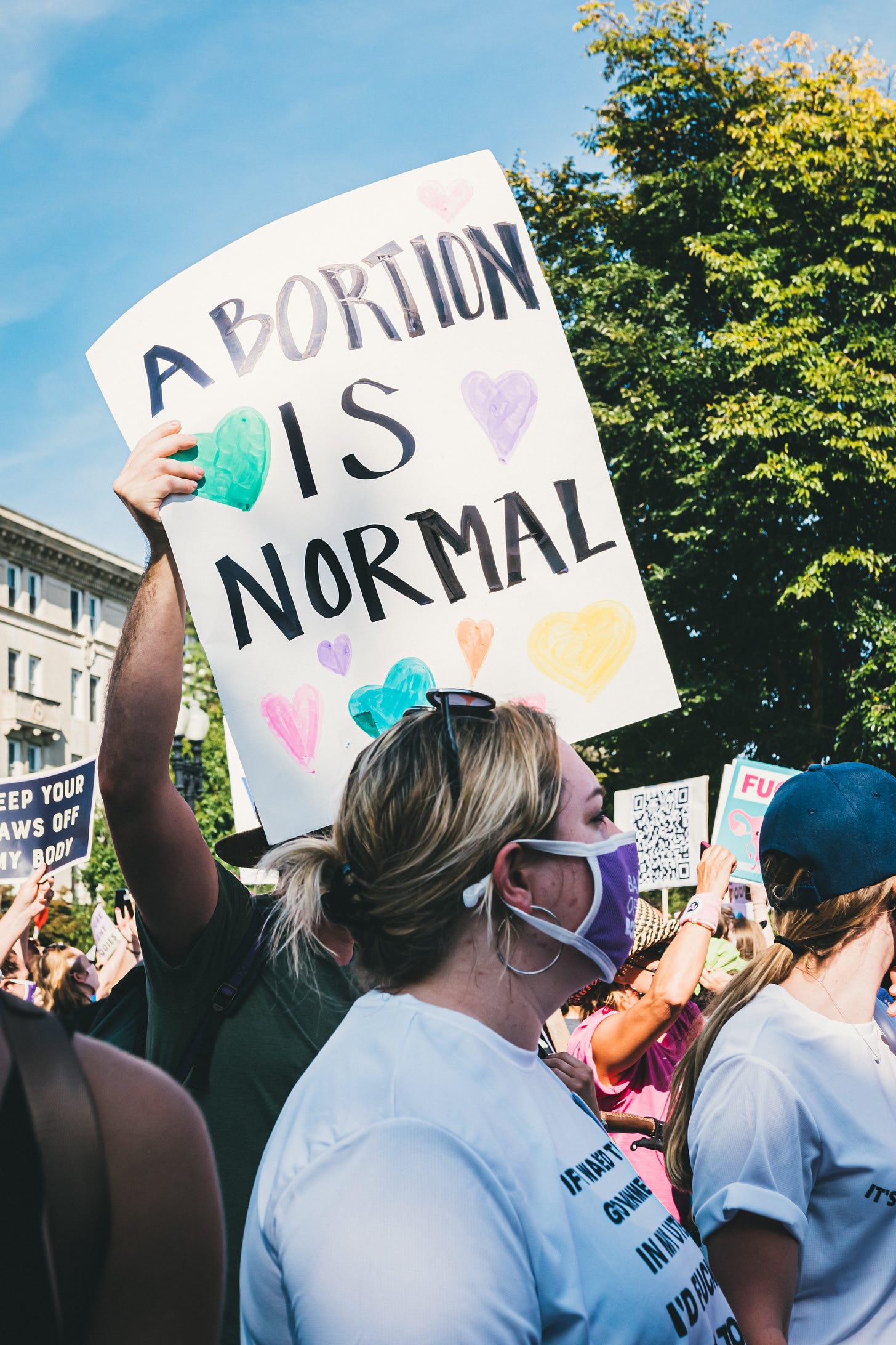 A close-up of a handwritten sign at an abortion rights protest in the US. The sign says ‘Abortion Is Normal.’