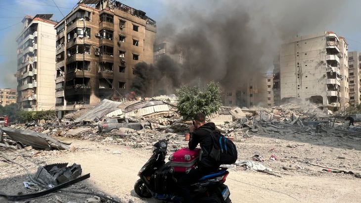 Smoke rises at the site of Israeli airstrikes in Beirut's southern suburbs, Saturday, Sept. 28, 2024. (AP Photo/Hussein Malla)