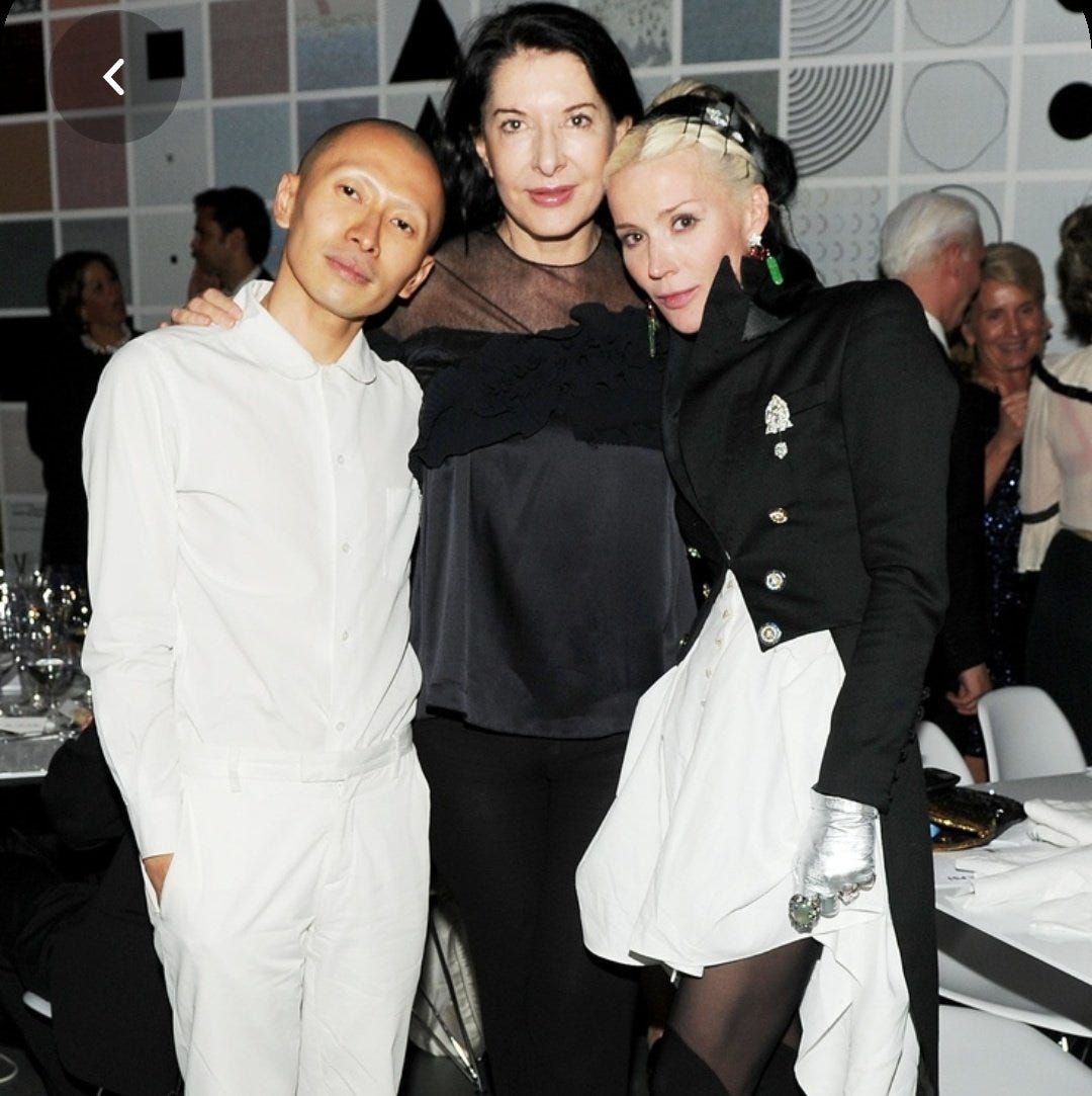 Daphne is highly involved with the usual Suspects of the cult. Including Marina Abramovich, Lady Gaga and famous doorknob/ scarf suicide victims L'Wren Scott and Alexander McQueen.