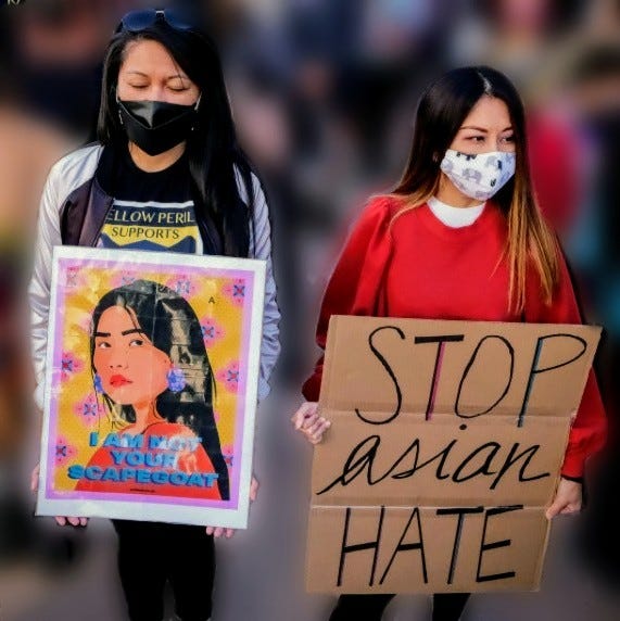 Demonstrators raise awareness of anti-Asian violence at the Japanese American National Museum in Little Tokyo in Los Angeles, California