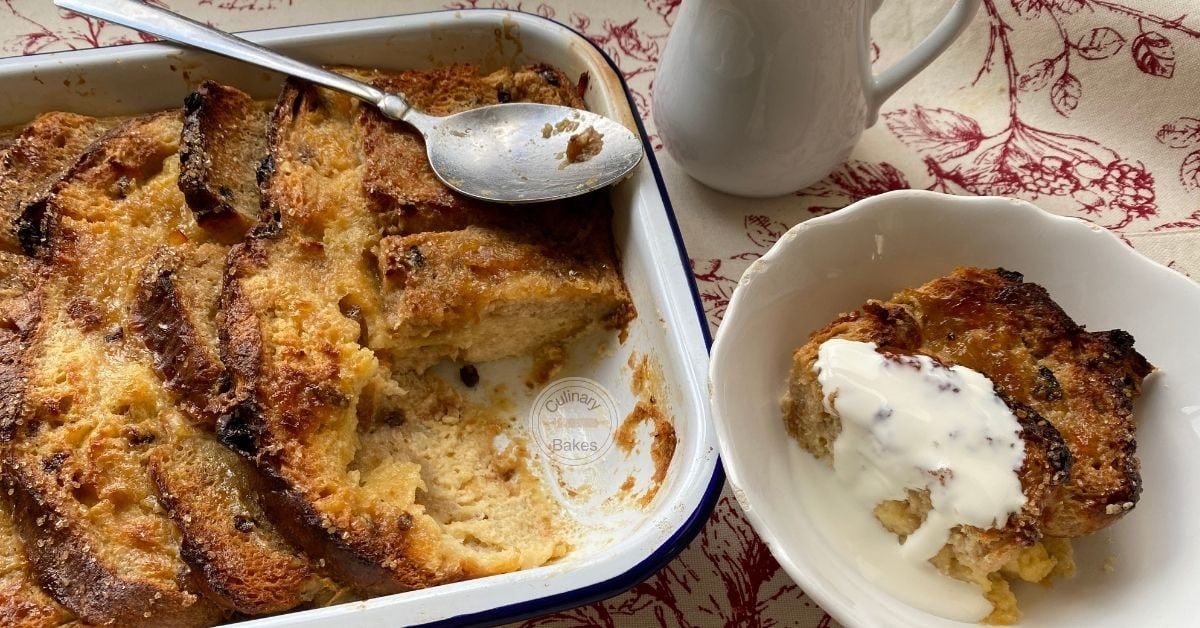 Panettone Bread and Butter Pudding in a baking dish with a portion taken out and served with cream.