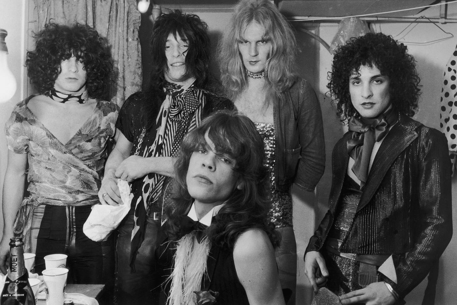 Influential American glam rock band the New York Dolls in their dressing room, 30th October 1972. Standing, left to right: Jerry Nolan, Johnny Thunders, Killer Kane and Sylvain Sylvain. Seated: singer David Johannson. (Photo by P. Felix/Daily Express/Hulton Archive/Getty Images)