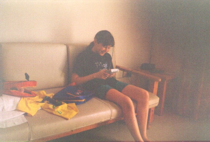Rachael pictured here on holiday in Spain enjoying Pokémon Yellow on her original Game Boy. She told us that she believes it was a bootleg copy of the game due to it being grey, but had no idea at the time!