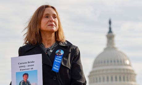 Kristin Bride with a photo of her 16-year-old son Carson Bride on the day she appeared before a Senate Committee on the Judiciary hearing to examine protecting our children online.