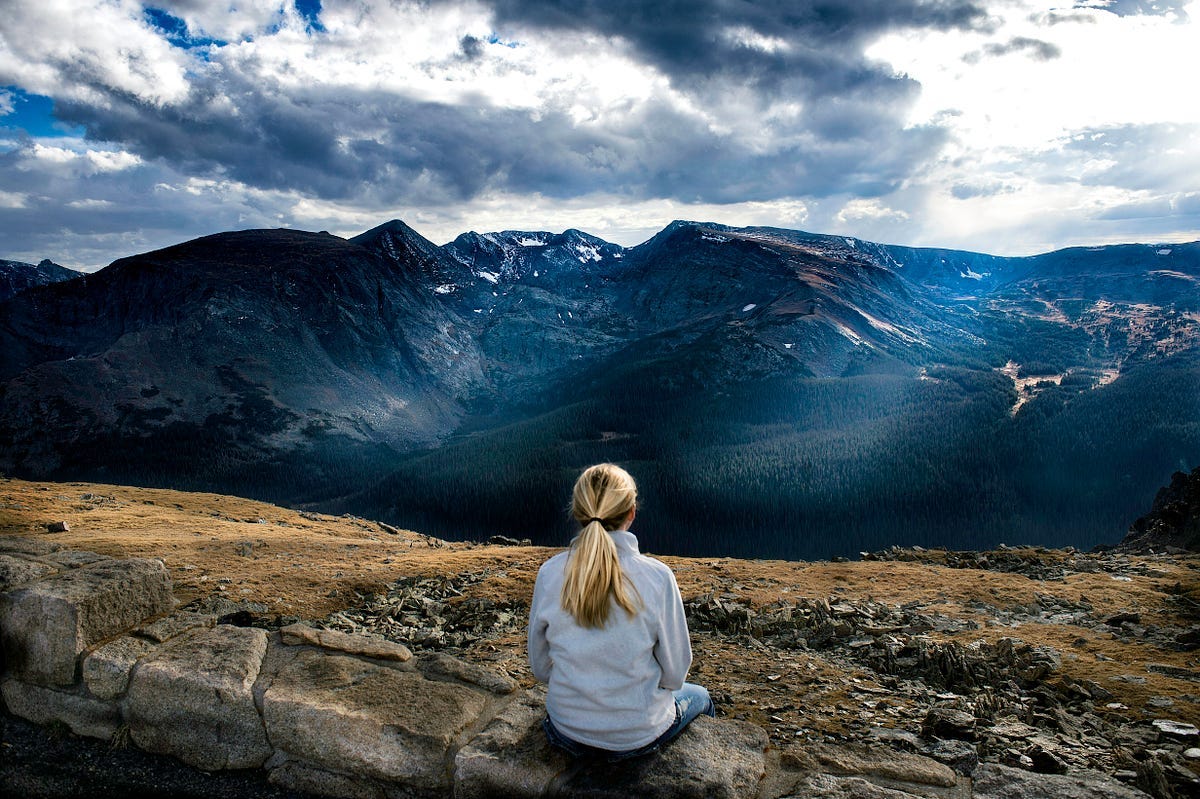 Person looking and looking at a mountain landscape Person looking and looking at a mountain landscape