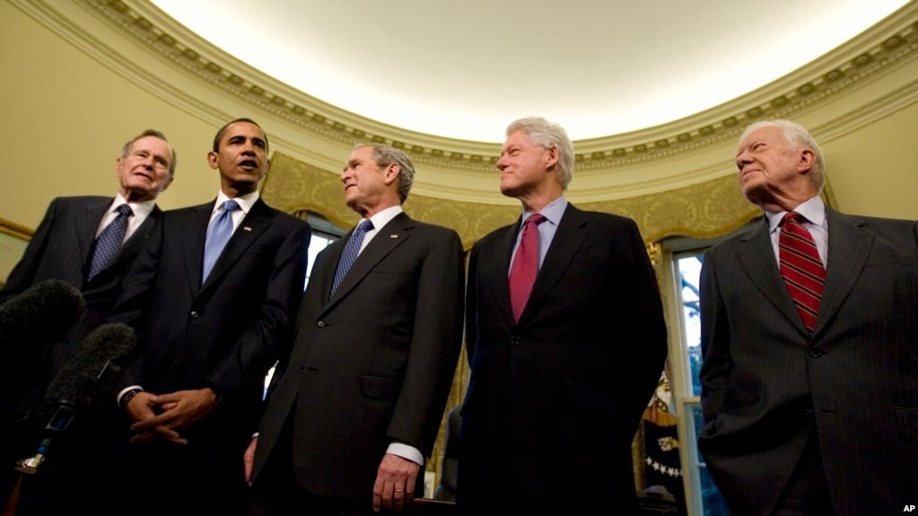 President George W. Bush hosts President-elect Barack Obama, and former presidents, from left, George H.W. Bush, Bill Clinton and Jimmy Carter, Jan. 7, 2009, in the Oval Office of the White House in Washington.