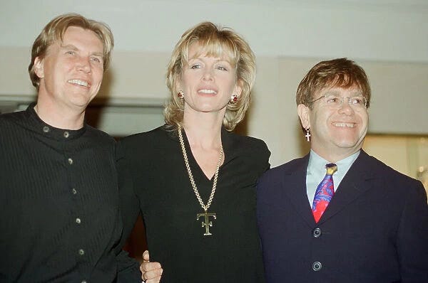 Theo and Louise Fennell with Elton John at the opening of