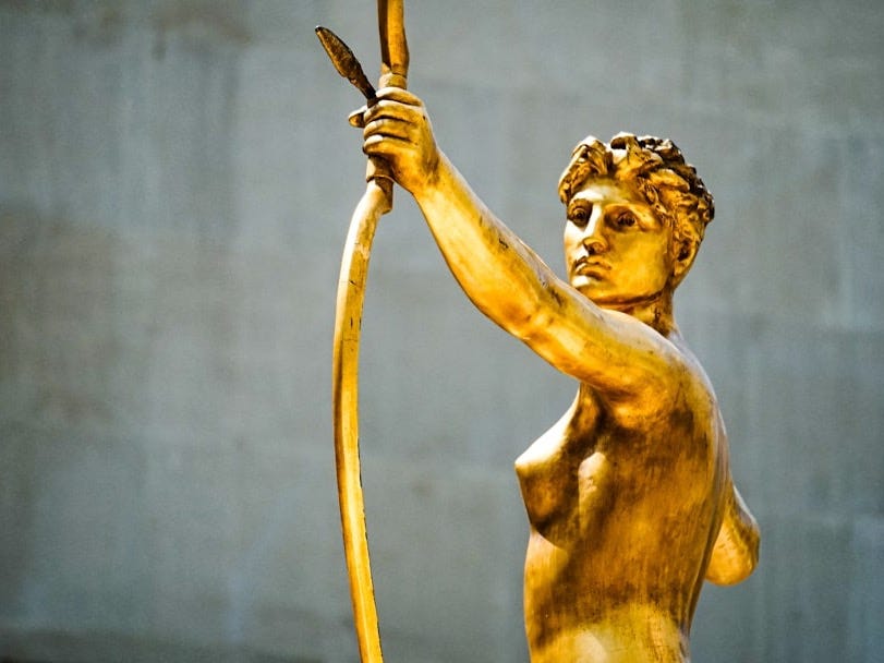 female with arrow statue