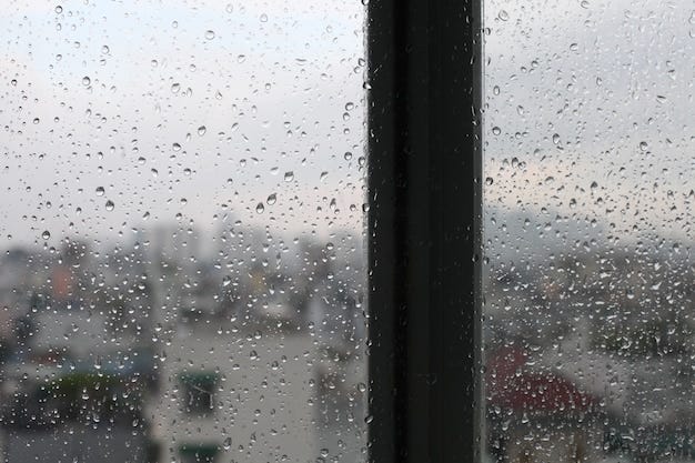 Vintage looking Urban scene seen through a window in a rainy day