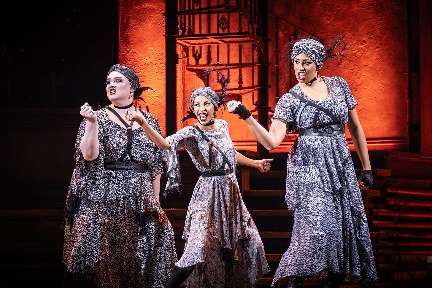 A photo showing the three fates dancing in Hadestown