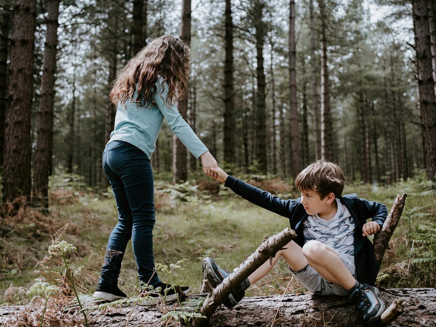 Girl helps fallen boy in woods Girl helps fallen boy in woods