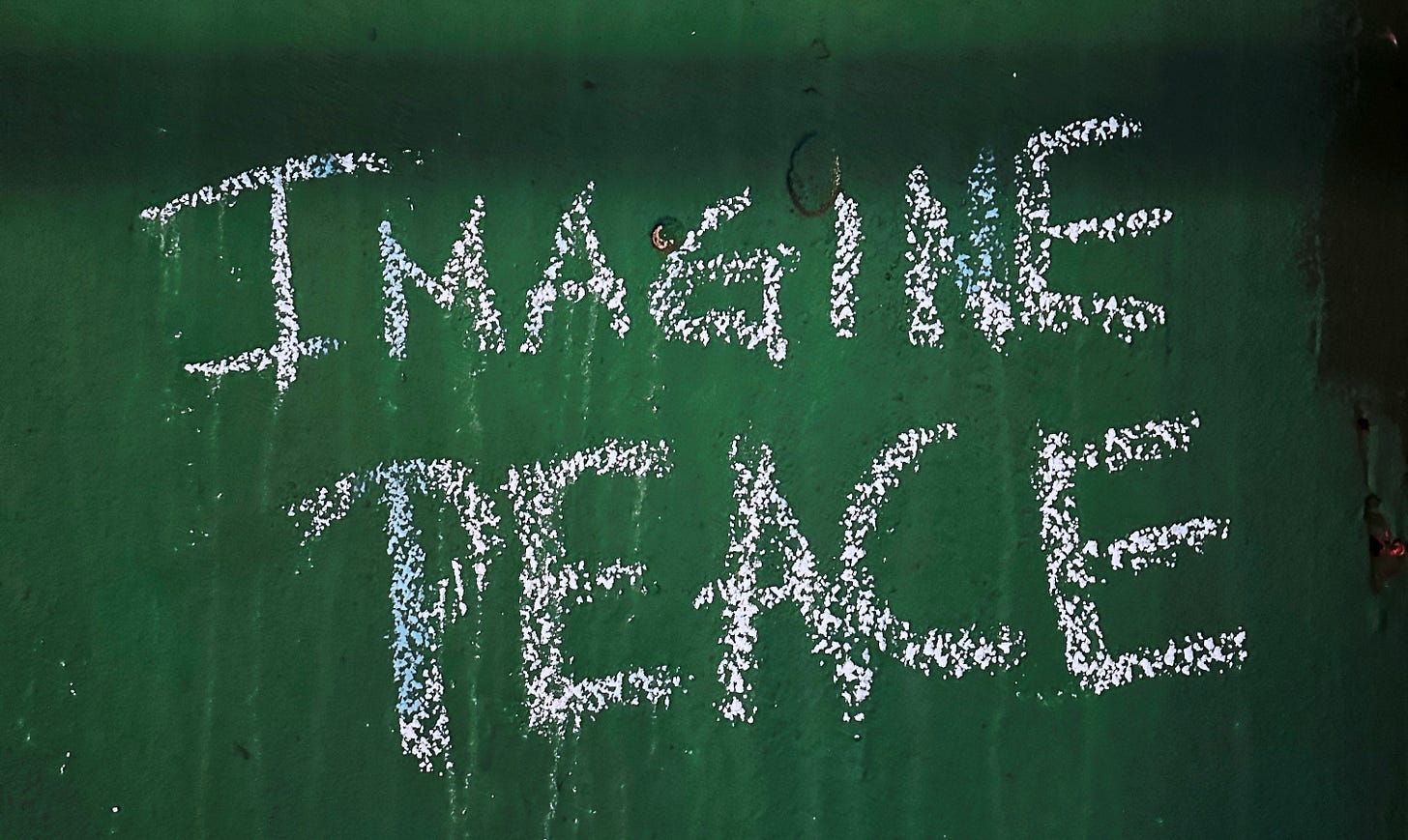 imagine peace written on a chalkboard