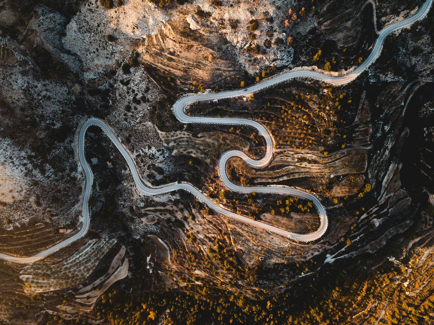 A winding mountain road photographed from above