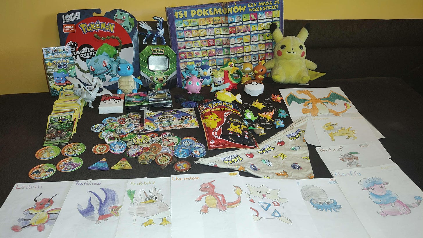 A photo of Mateusz and his vast collection of Pokémon figures, cards, tazos, key chains, a magazine, and many of his drawings