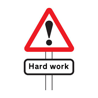 Warning sign reading "hard work"