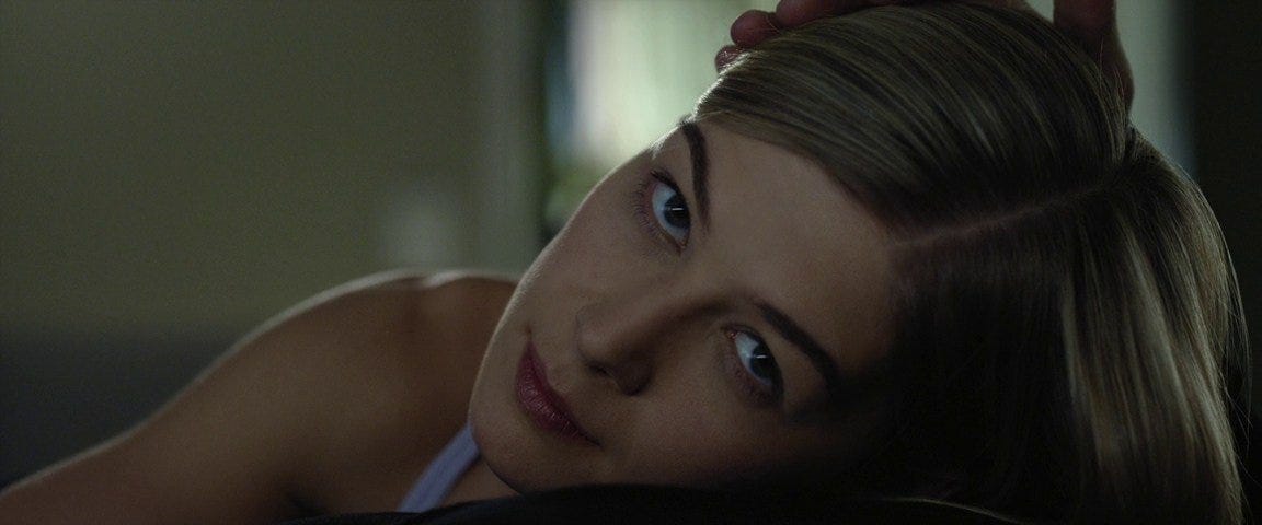 Amy Dunne lifts her head to look back up into the camera (Gone Girl, 2014)