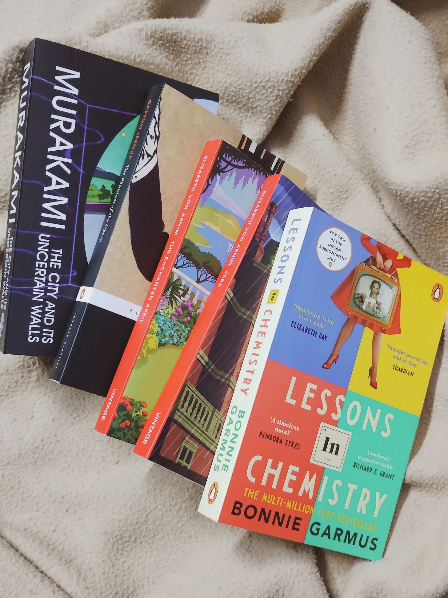 Five books on a blanket