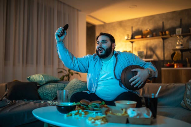 Fat Guy Watching Tv Stock Photos, Pictures & Royalty-Free Images - iStock