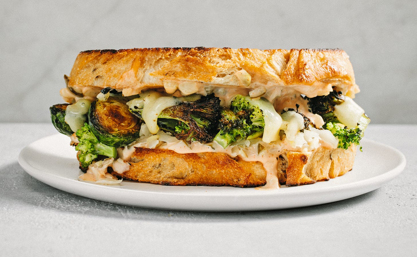 toasted vegetable reuben with cheese, broccoli, and brussels sprouts