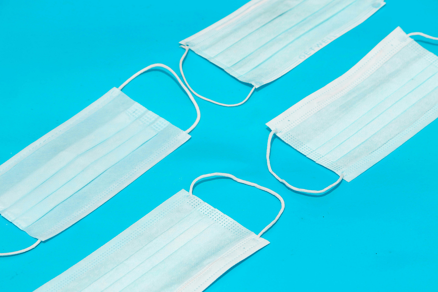 white paper on blue surface white paper on blue surface