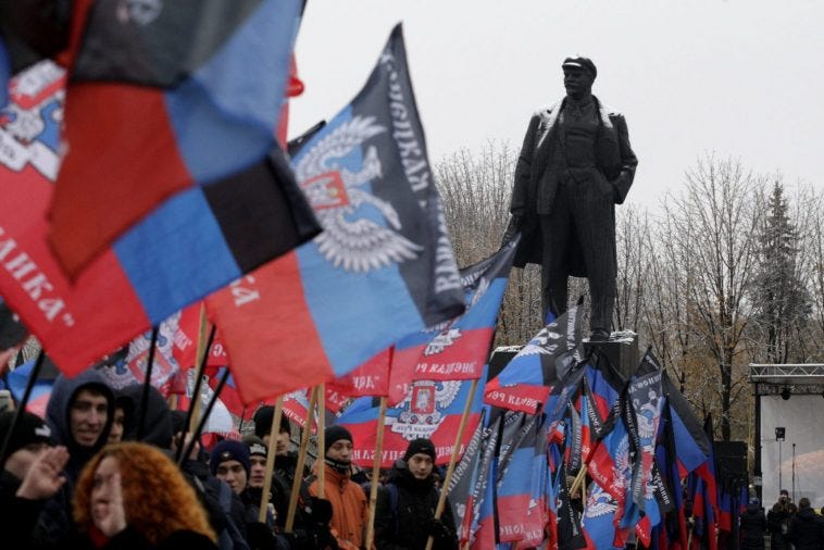 Flags of the so-called Donetsk People's Republic on display at a rally in Donetsk, Ukraine. REUTERS/Alexander Ermochenko