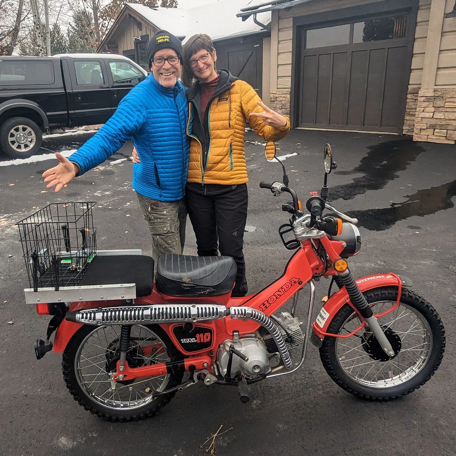 Andy and I posing with a small red Honda motorbike