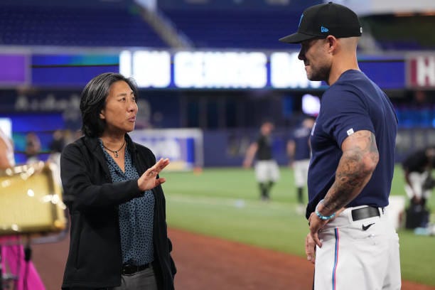 Kim Ng General Manager of the Miami Marlins talks with Skip Schumaker Manager of the Miami Marlins prior to the game against the Oakland Athletics at...