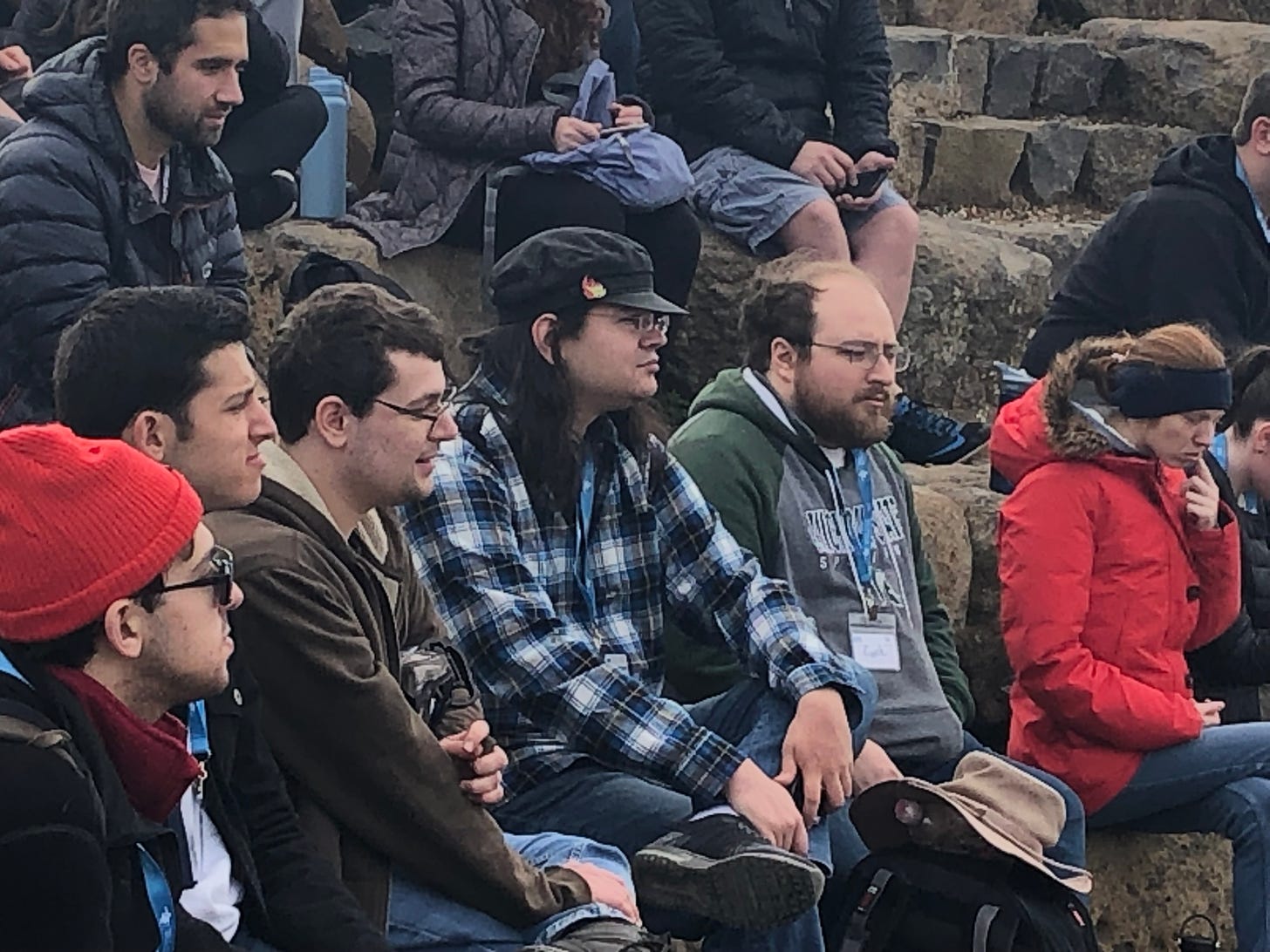 trip participants sit in an ampitheater