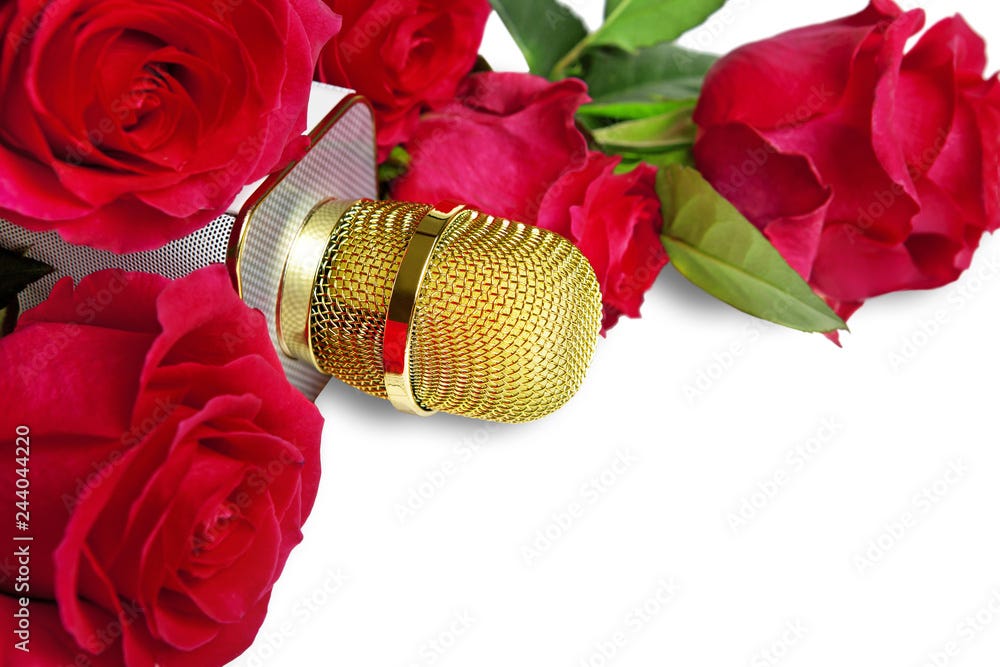 Golden microphone with a bouquet of red roses lie on a white background.  Stock Photo | Adobe Stock