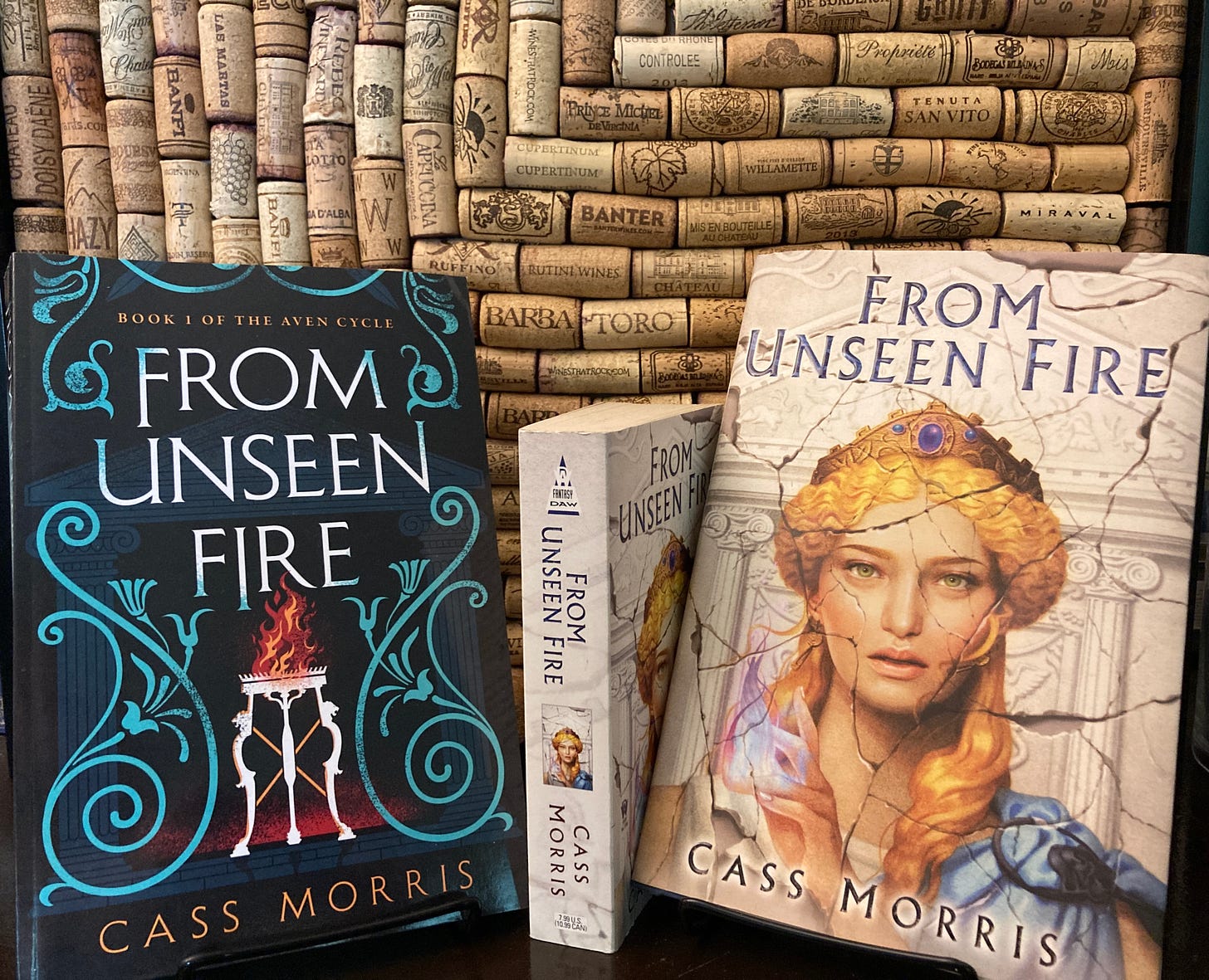 Three editions (hardcover, paperback, and mass market) of FROM UNSEEN FIRE by Cass Morris