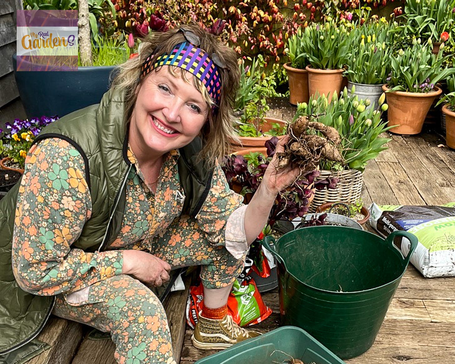 Ann-Marie Powell potting up dahlia tubers in her hampshire garden