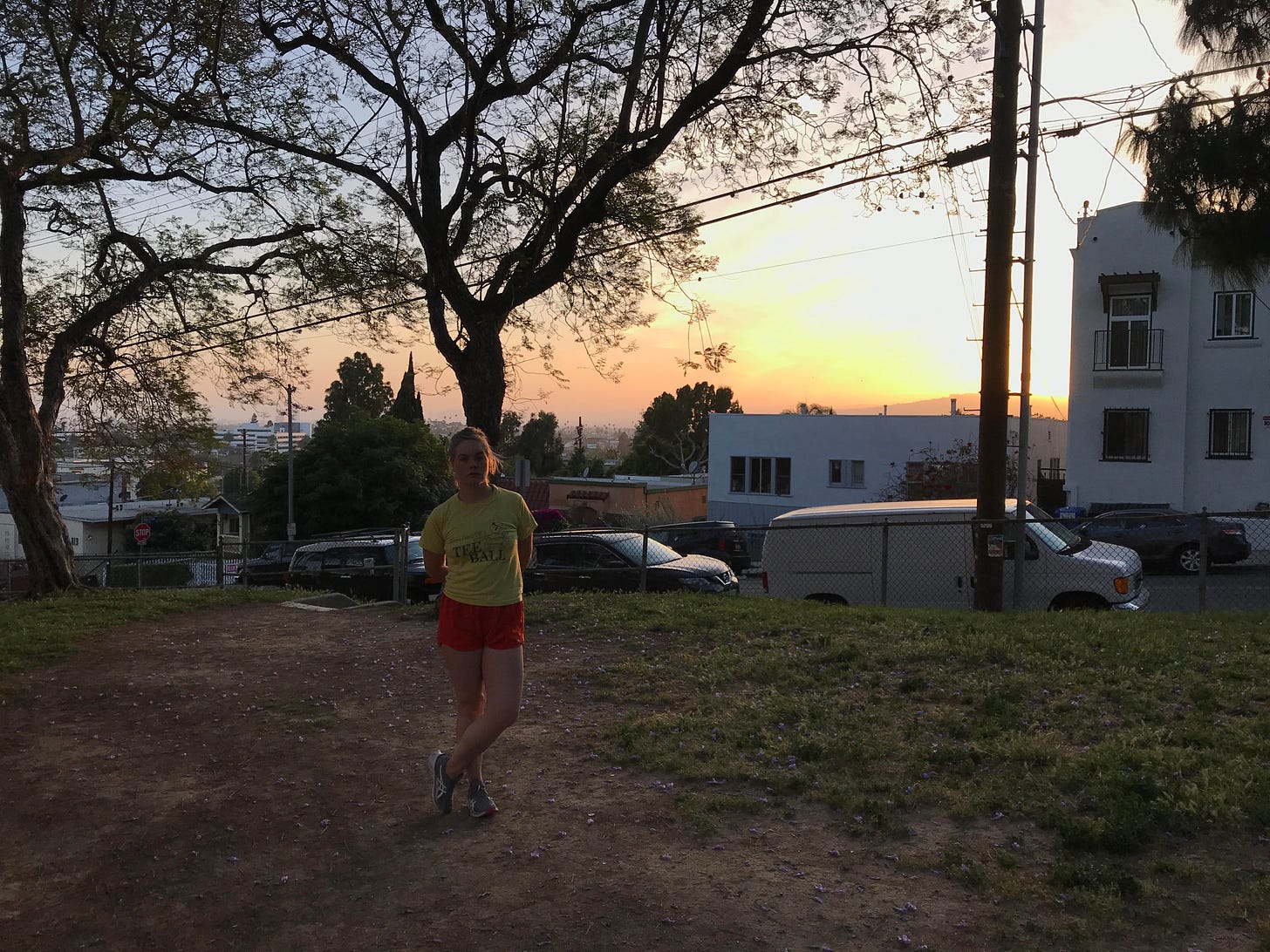 Photo of the author in a park at sunset.