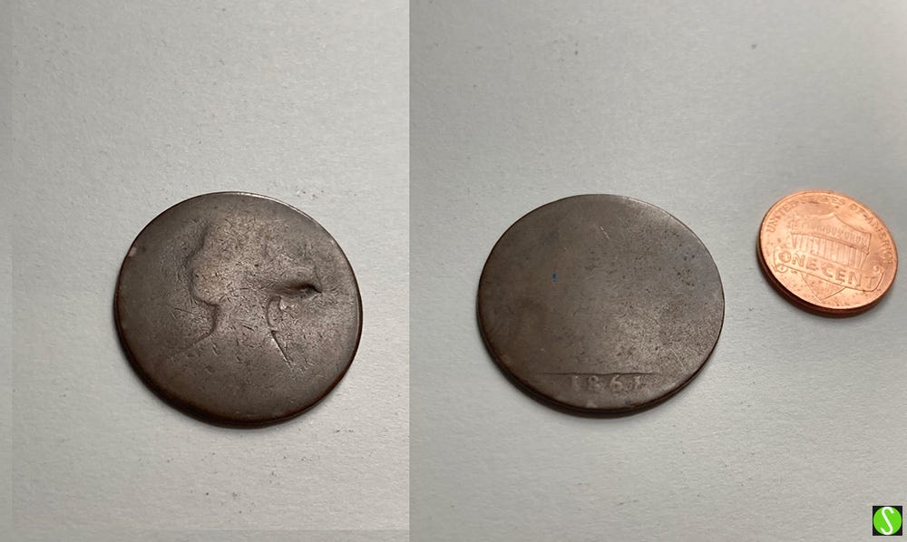 1861 UK penny, worn flat. Victoria