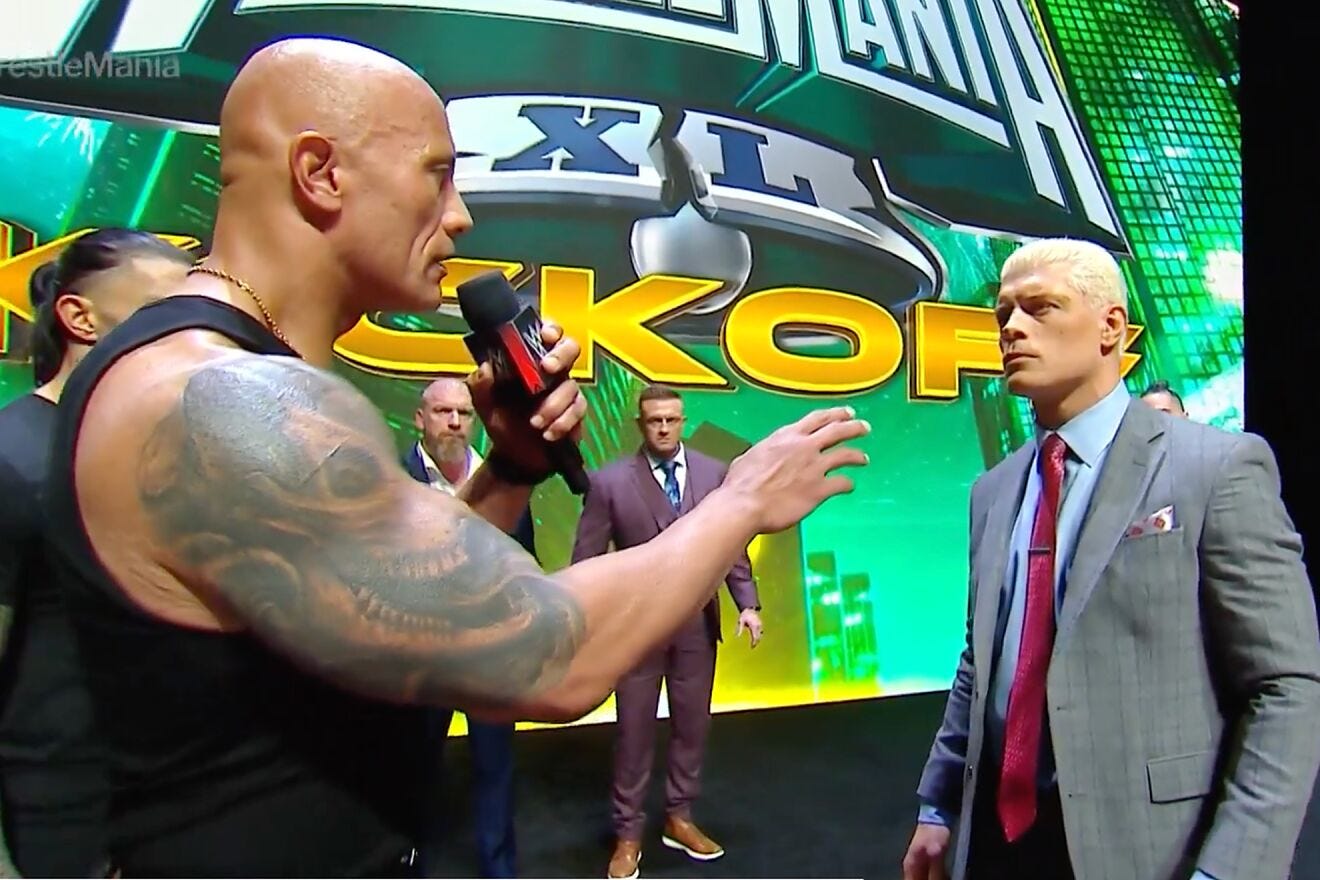 The Rock speaks to Cody Rhodes on Thursday night.